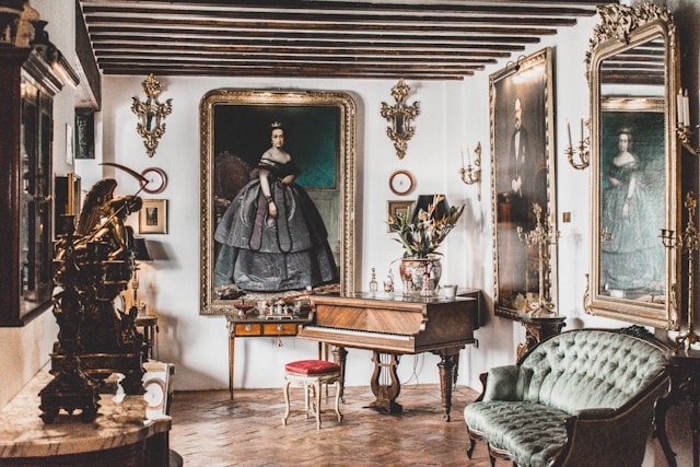 Historic parlor with oil portraits, gilt mirrors, and an antique grand piano documented for appraisal in Buffalo–Niagara Falls.