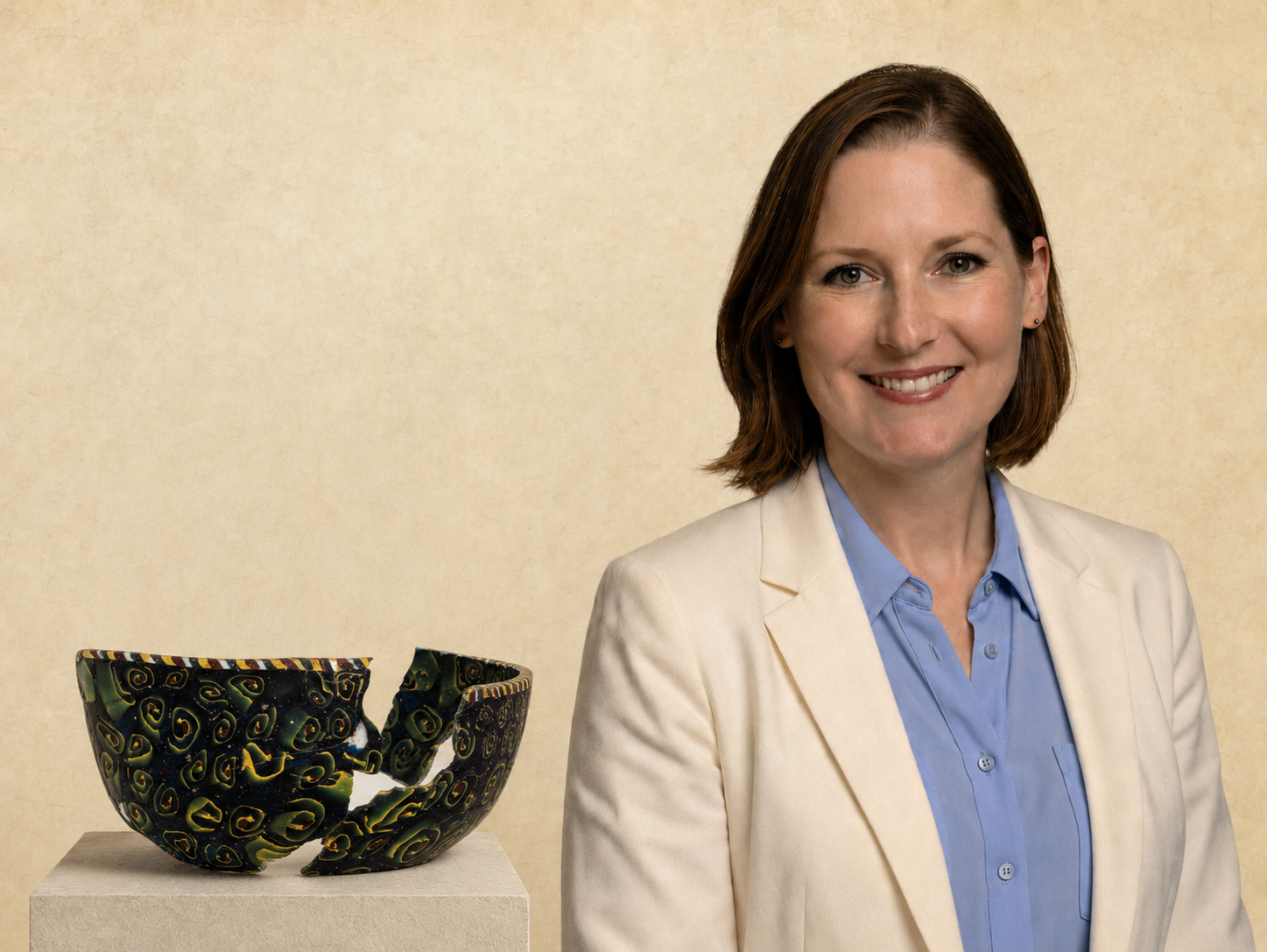 Anastasia Eikenberry beside a damaged glass vessel illustrating insurance damage and loss appraisal services
